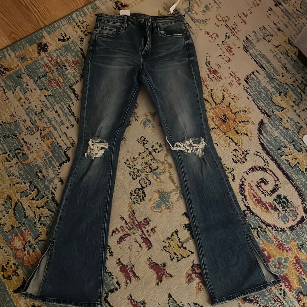 Flared ripped jeans, never worn